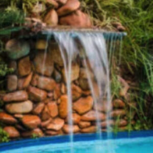 Why Add a Waterfall Around Your Swimming Pool?